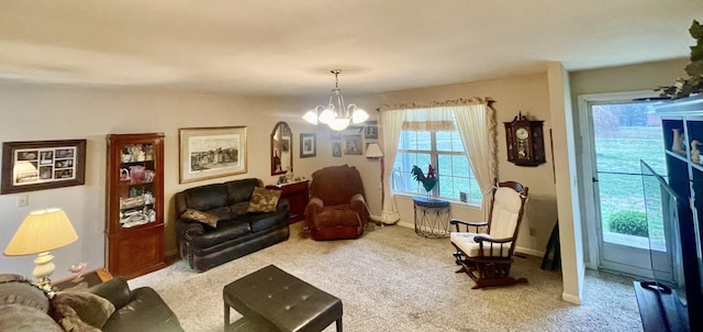 sitting room featuring an inviting chandelier and carpet floors