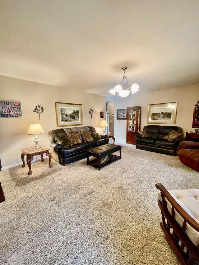 carpeted living room with a chandelier