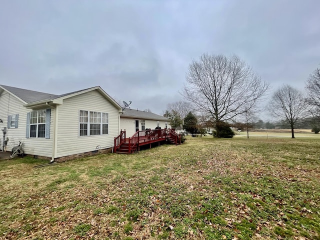 view of yard featuring a wooden deck