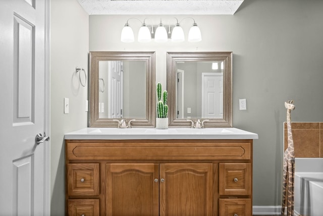 bathroom with vanity and a textured ceiling