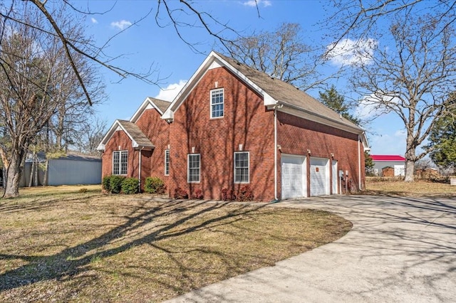 view of front of house with a garage and a front yard