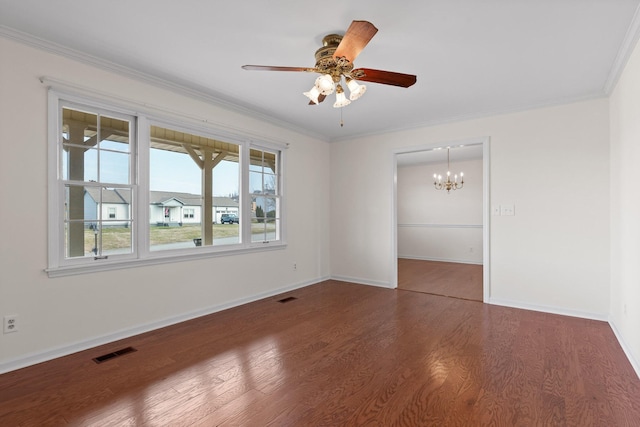 spare room featuring ceiling fan with notable chandelier, dark wood-type flooring, and ornamental molding