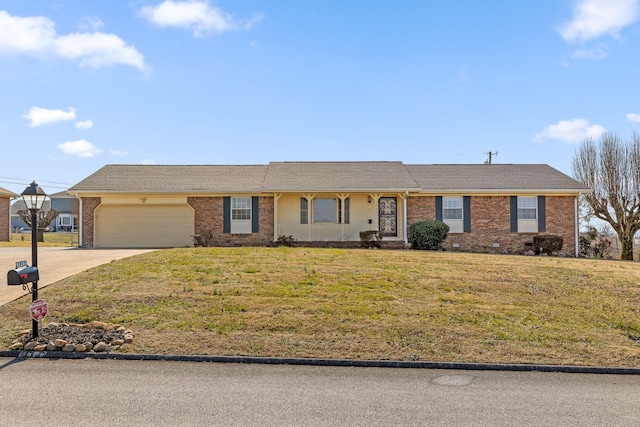 ranch-style house featuring a garage and a front yard