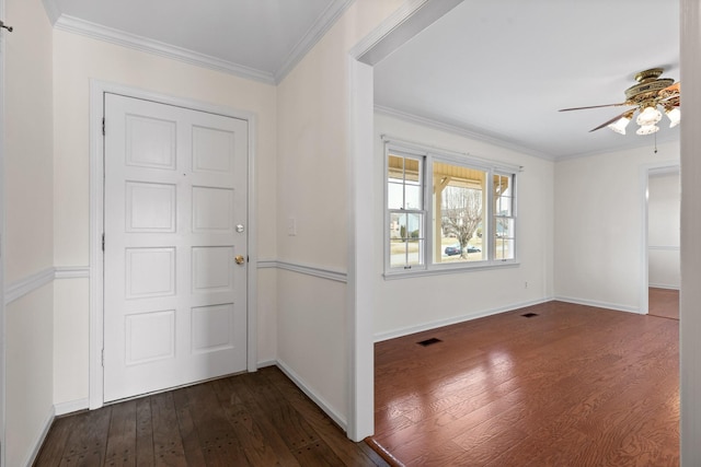 foyer entrance featuring ornamental molding, ceiling fan, and dark hardwood / wood-style flooring