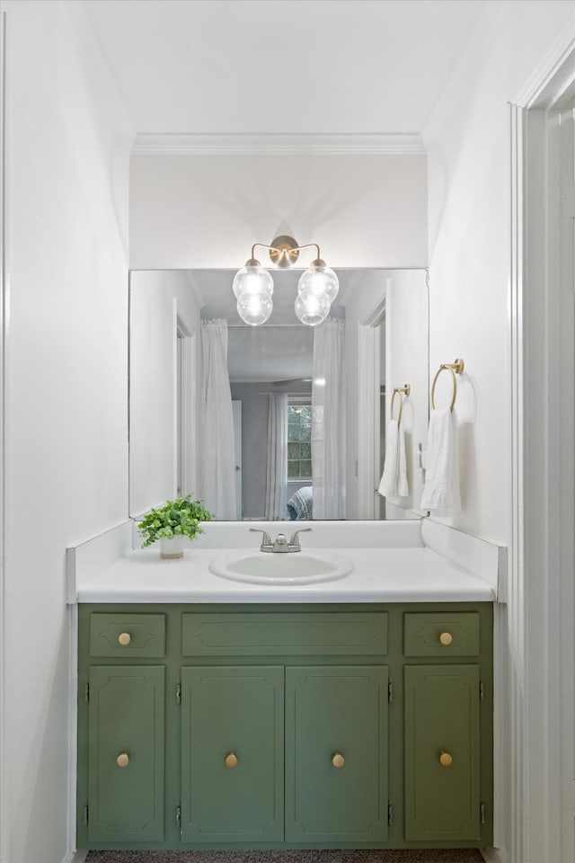 bathroom featuring ornamental molding and vanity