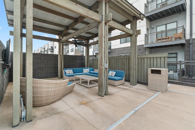 view of patio featuring an outdoor hangout area and ceiling fan