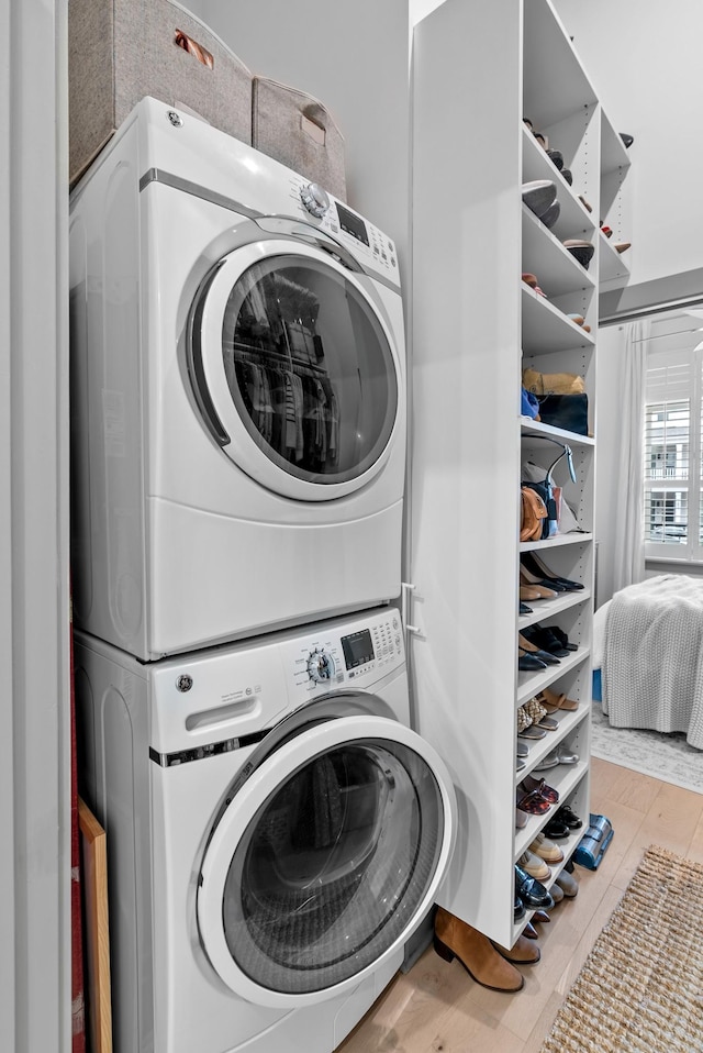 washroom with stacked washer and clothes dryer