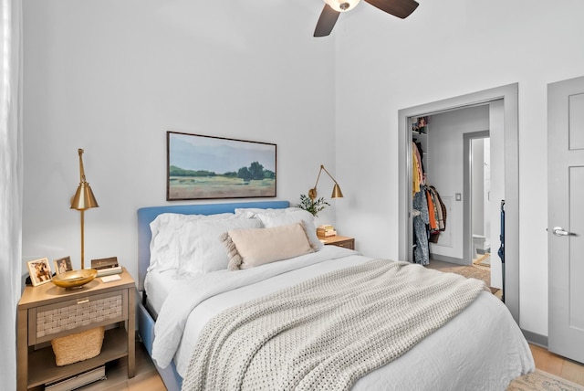 bedroom with light hardwood / wood-style flooring and ceiling fan