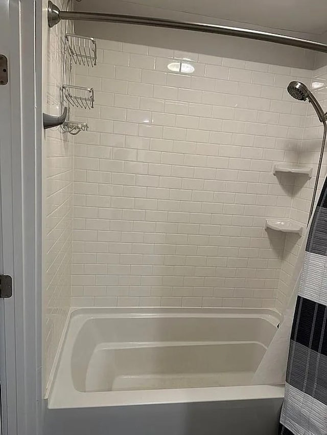 bathroom featuring shower / bathtub combination with curtain