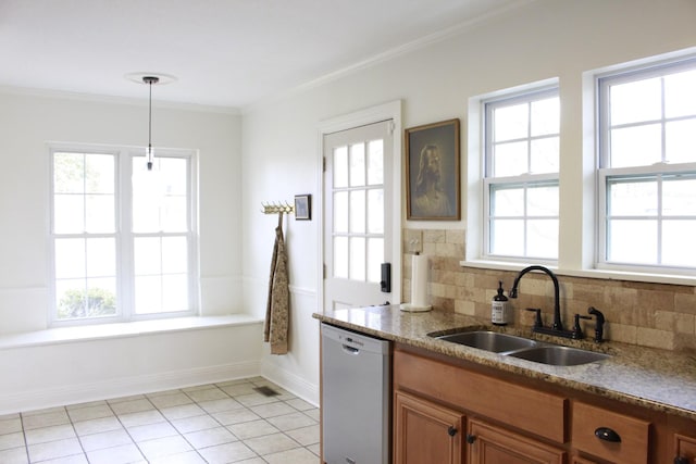 kitchen with dishwasher, sink, decorative backsplash, and decorative light fixtures