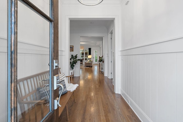 hall with crown molding and dark wood-type flooring