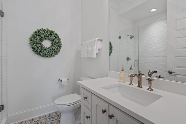 bathroom with vanity, an enclosed shower, and toilet