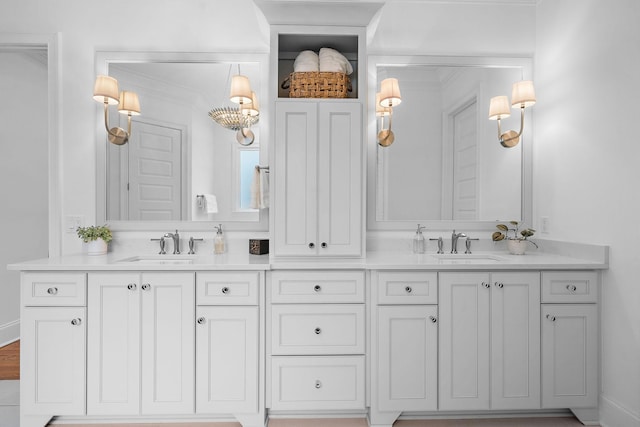 bathroom featuring vanity and ornamental molding