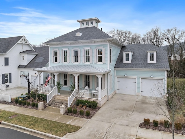 view of front of property with a garage and covered porch