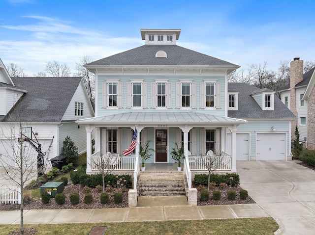 view of front of home featuring a porch and a garage