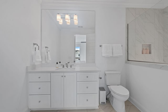 bathroom featuring crown molding, vanity, and toilet