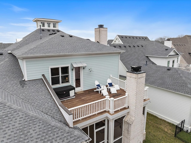 back of house with a wooden deck