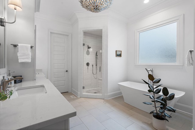 bathroom with independent shower and bath, ornamental molding, and vanity