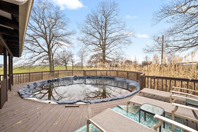 wooden deck with a covered pool