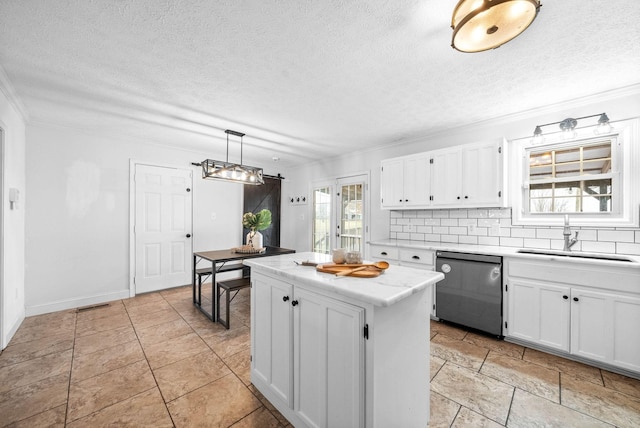 kitchen with sink, white cabinetry, dishwasher, a kitchen island, and pendant lighting