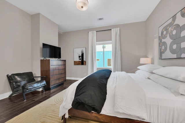 bedroom featuring dark hardwood / wood-style floors