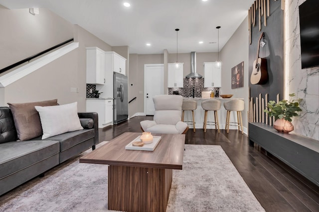 living room with dark hardwood / wood-style floors