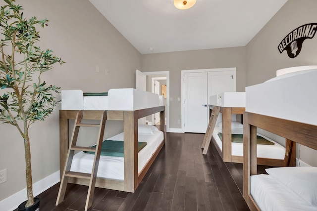 bedroom with dark hardwood / wood-style floors