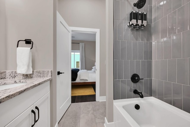 bathroom with vanity and tiled shower / bath