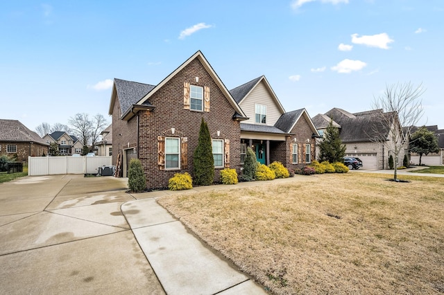 front of property with a garage and a front lawn