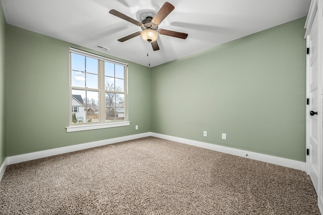 carpeted empty room featuring ceiling fan