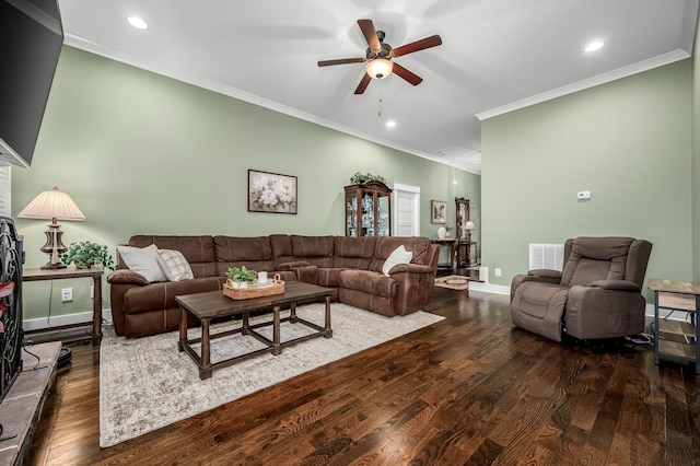 living room featuring ornamental molding, dark hardwood / wood-style floors, and ceiling fan