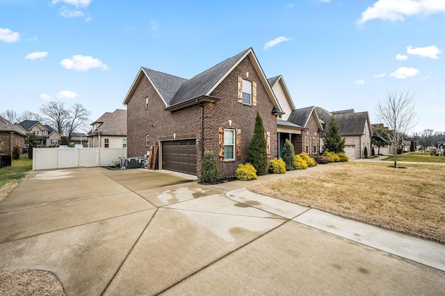 view of side of home with a yard and a garage