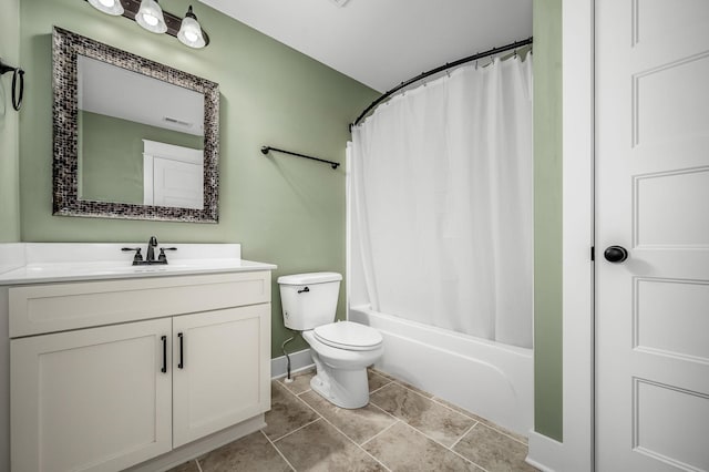 full bathroom with shower / tub combo with curtain, vanity, toilet, and tile patterned flooring