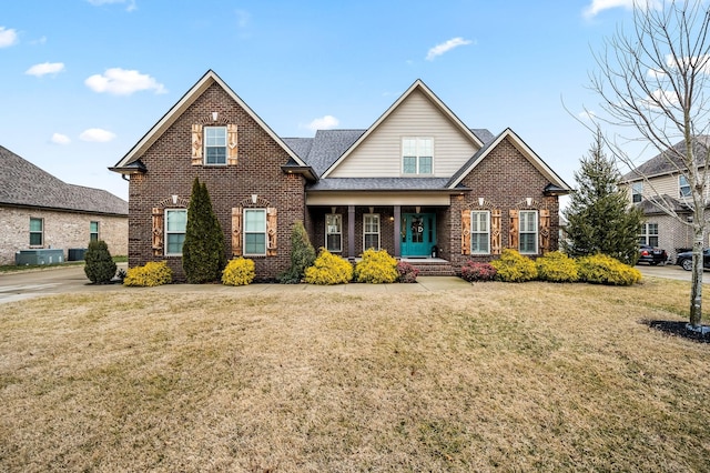 front of property featuring central AC unit and a front yard