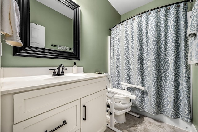 bathroom with vanity, tile patterned flooring, and toilet