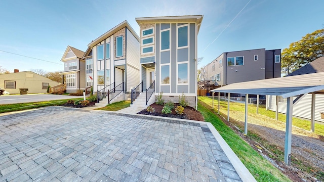 view of front of property featuring a carport