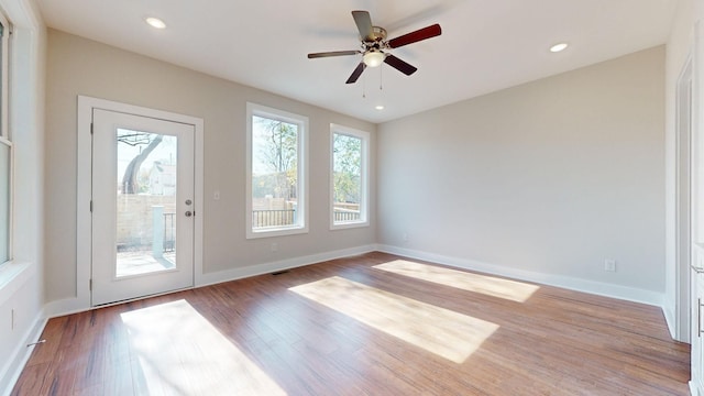 unfurnished room with wood-type flooring and ceiling fan