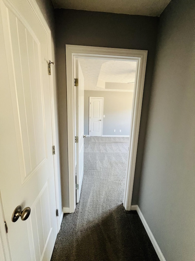 hallway with carpet