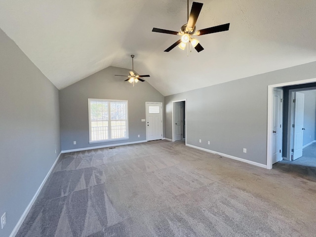 unfurnished living room with light carpet, lofted ceiling, and ceiling fan