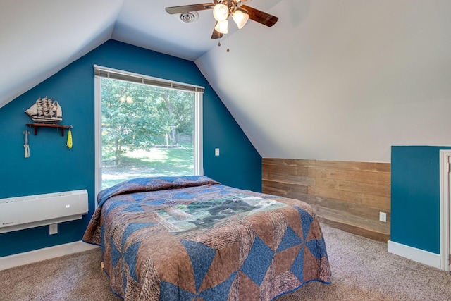 carpeted bedroom featuring ceiling fan, lofted ceiling, and wooden walls