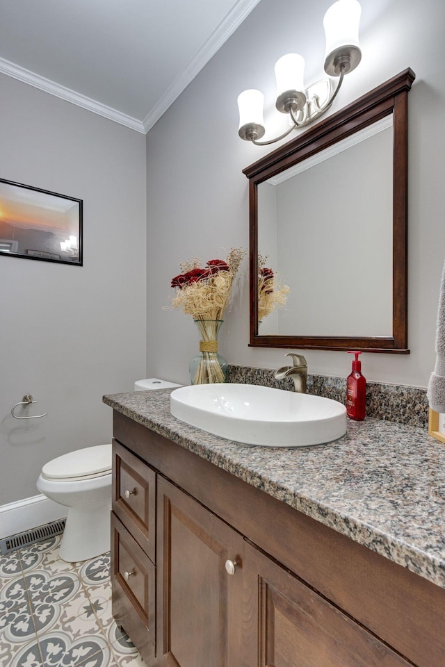 bathroom featuring crown molding, toilet, tile patterned floors, and vanity