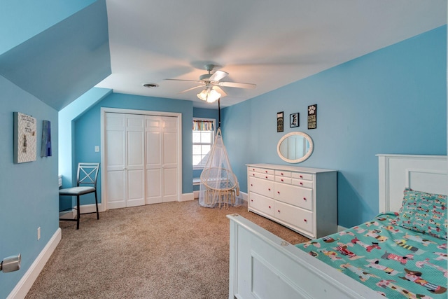 carpeted bedroom with ceiling fan and a closet