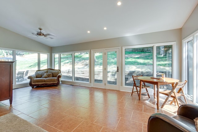 sunroom featuring ceiling fan and vaulted ceiling