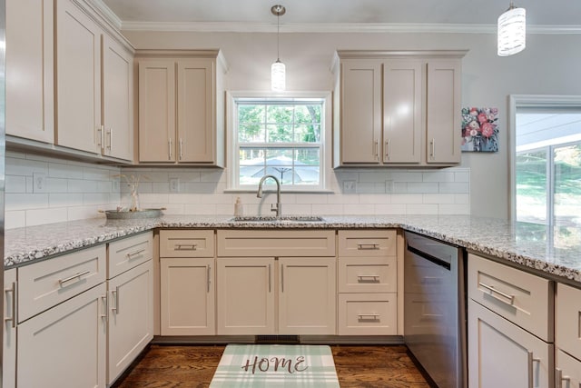 kitchen featuring pendant lighting, stainless steel dishwasher, light stone countertops, and sink