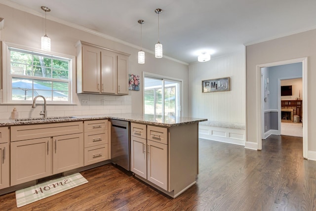 kitchen featuring decorative light fixtures, dishwasher, sink, kitchen peninsula, and light stone countertops