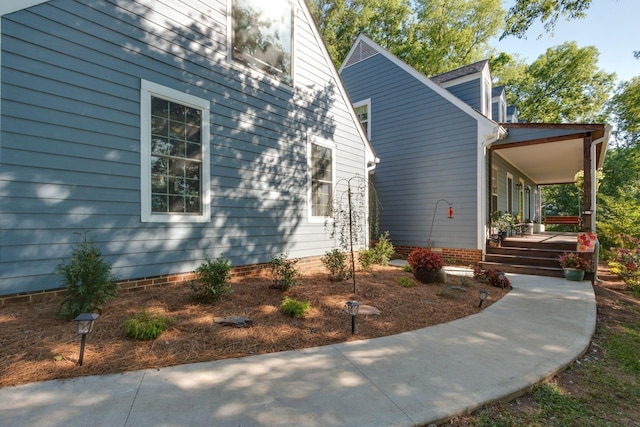 view of side of property featuring a porch