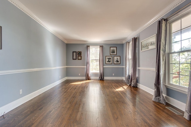 unfurnished room with ornamental molding, dark hardwood / wood-style floors, and a healthy amount of sunlight