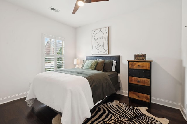 bedroom featuring dark wood-type flooring and ceiling fan