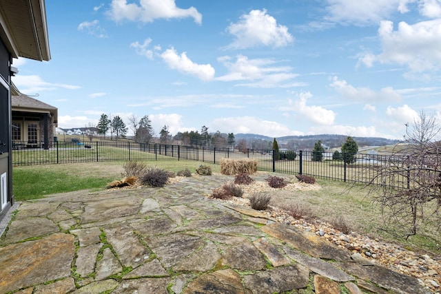 view of yard with a mountain view, a rural view, and a patio area