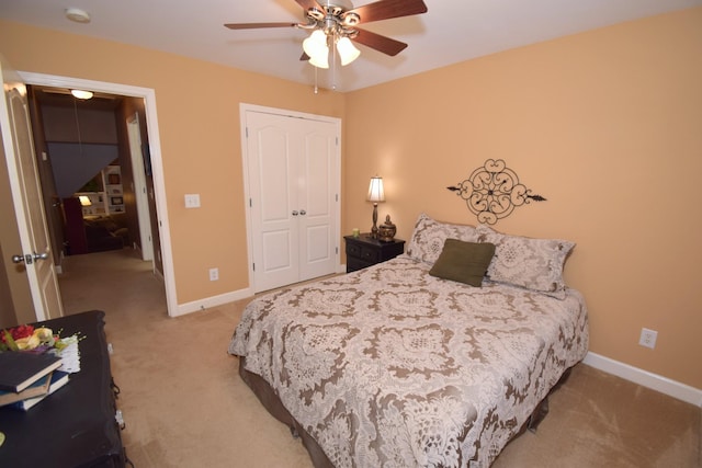 bedroom featuring ceiling fan, carpet flooring, and a closet